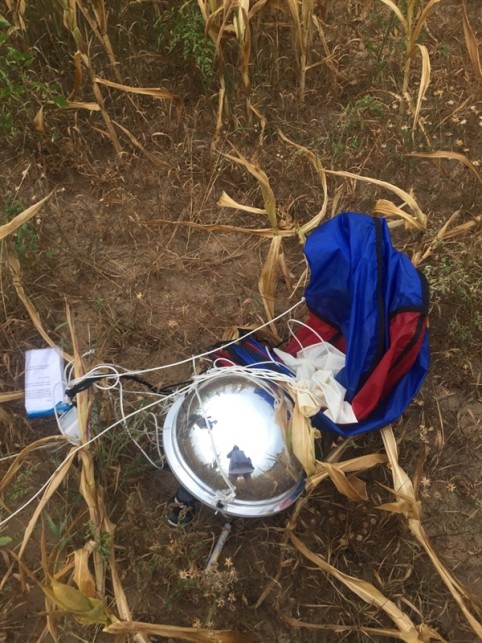 The probe after its parachute landing in a Belarusian cornfield. 